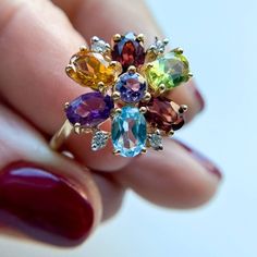 Multi Gemstone and Diamond Flower Vintage Ring 14K Yellow Gold Aquamarine Garnet Citrine Amethyst all the gemstones are 6x4mm Diamond 1.5mm 3.9gm Size 6 Thank you for visiting our shop! 𝑫𝑴𝑲 𝑱𝒆𝒘𝒆𝒍𝒓𝒚 Each order will be beautifully packaged Our jewelry is 100% Authentic Please feel free to look at the other items I hope you will find something else that will like and interest you. EVERY DAY JEWELRY!!! Perfect gift for any occasion. Multicolor Oval Amethyst Gemstone Ring, Oval Multi-stone Flower Ring Gift, Oval Multi-stone Flower Ring For Anniversary, Fine Jewelry Flower Cluster Ring With Gemstone, Multicolor Oval Amethyst Ring, Flower Vintage, Diamond Flower, Vintage Ring, Multi Stone