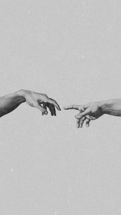 two hands reaching out towards each other