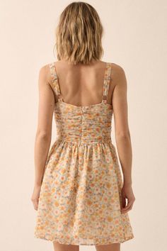 Floral-print chiffon mini dress. Sweetheart neckline. Ruched bodice with rose accent. Sleeveless with adjustable shoulder straps. Low back with invisible zipper closure. Full lining. Thigh length. Fit-and-flare silhouette. 100% Polyester. Imported. Designed in LA. Model wears size S. Summer Sundress With Ruched Bodice And Sweetheart Neckline, Sundress With Ruched Bodice And Sweetheart Neckline, Summer Dress With Sweetheart Neckline And Ruched Details, Fitted Sundress With Ruched Bodice And Sweetheart Neckline, Summer Sundress With Ruched Sweetheart Neckline, Summer Dress With Smocked Back And Sweetheart Neckline, Sleeveless Sundress With Ruched Bodice For Garden Party, Summer Mini Dress With Ruched Sweetheart Neckline, Summer Sundress With Sweetheart Neckline And Ruched Detail