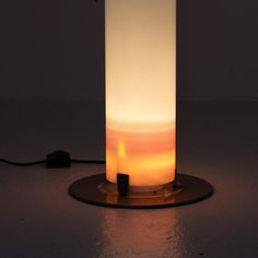 a light that is sitting on top of a table next to a phone charger