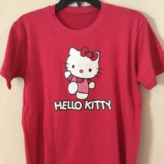 Rose Pink Hello Kitty T-Shirt, Soft Cotton Material Casual Pink Hello Kitty T-shirt, Pink Hello Kitty Cotton Top, Trendy Cotton T-shirt With Hello Kitty Print, Pink Cotton Hello Kitty T-shirt, Cute Pink Hello Kitty T-shirt, Trendy Pink Hello Kitty T-shirt, Pink Hello Kitty Short Sleeve T-shirt, Pink Hello Kitty Crew Neck T-shirt, Pink Short Sleeve Hello Kitty T-shirt