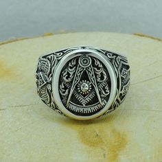 "Beldiamo 10 g Sterling Silver Past Master Masonic Symbol Ring Big Signet Freemacon Ring Gift Men Masonic Gift Jewelry * 100% polished solid sterling silver * .925 trademark stamp * Solid sterling silver weight: approx. 10 Grams, depending on the size of the ring * Measurement of ring face : 18 mm / 0.39 in x 15 mm / 0.59 in * Crafted and polished by hand * R0206-GJ-10 Fact Past Master Masonic Symbol-The Compass, Square, Sun, and Quadrant in the world. his symbol includes the Square as a reminde Symbolic Nickel-free Oval Jewelry, Symbolic Oval Nickel-free Jewelry, Symbolic Adjustable Jewelry For Formal Occasions, Nickel-free Oval Symbolic Jewelry, Symbolic Oval White Gold Jewelry, Symbolic White Gold Oval Jewelry, Adjustable Silver Etched Signet Ring, Symbolic Formal Jewelry With Etched Details, Adjustable Etched Silver Signet Ring