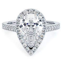 a pear shaped diamond ring with pave set diamonds on the band and an oval center stone