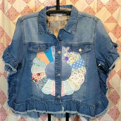 a jean jacket with patchwork and patches on it