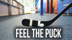 a hockey stick with the words feel the puck on it