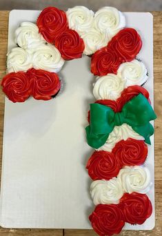 a decorated cake with red and white frosting