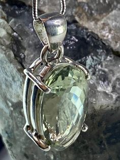 An elegantly beautiful Green Amethyst (Prasiolite) and silver pendant including the chain.  The stone is of a good size, a beautiful light green colour, oval-cut and set in a classic prong setting.  The pendant measures - 2.3cm Long x 1.2cm wide x 1.0cm deep. Pendant weight - 8 grams. Product made hypoallergenic with pure 925 silver and nickel free. Customers can choose the following purchase options: 1) - The pendant separately  2) - Including the stunning 1mm diameter solid Italian silver snak Silver Green Amethyst Gemstones For Gift, Linking Rings, The Chain, Watermelon Tourmaline, Green Colour, Green Amethyst, Silver Earrings Dangle, Color Of Life, Snake Chain