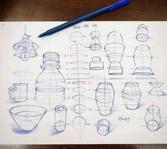 a paper with some drawings on it next to a blue pen and a cup filled with liquid