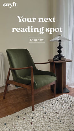 a green chair sitting on top of a wooden floor next to a table with a lamp