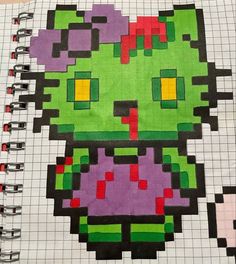 a notebook with an image of a cartoon character in pixel art on the front cover