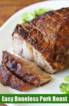 a piece of meat on a plate with broccoli and the words easy pork roast