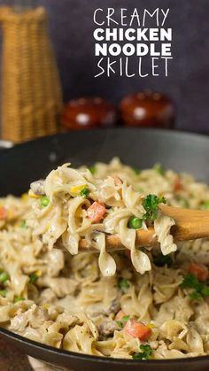 creamy chicken noodle skillet with wooden spoon