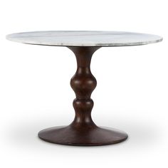 an oval marble top dining table with wooden base and round legs, on a white background