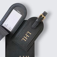 A stylish essential for jet-setting individuals, these tags will make it easy to spot your luggage on any busy luggage carousel. Available in classic black, each one has an adjustable strap and gold detailing. Give it a personal touch by adding initials in a range of colours. Want your luggage tag wrapped? Add gift wrapping and it will arrive in a branded bag so you can send it directly to the recipient. Looking for matching passport holders, you can find these here: www.etsy.com/uk/listing/1202473875 Size: 6 x 11 cm (6 x 14 cm including the strap). Shipping: Ready to ship in 5-10 business days. If you need this quicker please contact me before ordering. Classic Black Rectangular Travel Accessories, Luxury Luggage Tag With Sleeve For Travel, Classic Travel Bags With Rfid Blocking, Black Rfid Blocking Travel Case, Luxury Rectangular Luggage Tag With Sleeve, Modern Rectangular Luggage Tag For Travel, Rectangular Monogram Luggage Tag For Everyday Use, Elegant Rectangular Luggage Tag For Travel, Black Luggage Tag With Luggage Sleeve For Travel