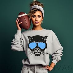 This sweatshirt is a must-have addition to the wardrobe of any devoted Panthers fan. Whether you're tailgating at Bank of America Stadium or cheering for your team from afar, this sweatshirt guarantees you stay warm and stylish throughout the season. Show your Panthers pride with this Carolina Panthers sweatshirt. It's also a fantastic gift for fellow fans who bleed black and blue. Ideal for any situation, a unisex heavy blend crewneck sweatshirt is pure comfort. These garments are made from polyester and cotton. This combination helps designs come out looking fresh and beautiful. The collar is ribbed knit, so it retains its shape even after washing. There are no itchy side seams on these sweaters.  .: Made with a medium-heavy fabric blend of 50% cotton and 50% polyester (8.0 oz/yd² (271.2 Sports Fan Long Sleeve Tops For Streetwear, Long Sleeve Tops For Sports Fans Streetwear, Sporty Fan Gear Tops For Winter, Casual Football Season Fan Gear Hoodie, Winter Sweatshirt With Team Logo For Fans, Team-colored Fleece Top For Game Day, Casual Hoodie For Football Season Fan Gear, Varsity Fleece Top For Fan Gear, Team-colored Winter Fan Gear Sweatshirt