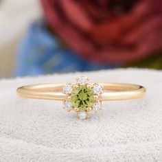 Description : Round Shaped Green Peridot Engagement 14K Solid Gold Ring, Certificated Genuine Peridot Diamond Wedding Ring, Peridot Birthstone Rings Diamond : 0.07 CT. F / SI (6 piece) Natural Green Peridot : 0.16 CT. (1 piece) Gram 1.33 (It may differ depending on the ring size) Product Code: MR0011859 This product belongs to Tilya Jewelery private collection . You can browse our store for other special collection products. All of our products are stamped and made of solid gold . All of our pro Peridot And Diamond Rings, Wedding Peridot Diamond Ring In Yellow Gold, Green Sapphire Ring In 14k Gold For Wedding, Yellow Gold Peridot Diamond Wedding Ring, Wedding Cluster Ring In Green With Round Cut, Green Sapphire Ring With Round Cut For Wedding, Green Halo Ring With Center Stone For Wedding, Green Diamond Cluster Ring With Birthstone, Gold Peridot Diamond Ring For May Birthstone