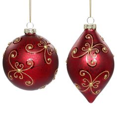 two red ornaments hanging from strings on a white background