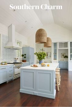 an open kitchen with blue cabinets and white counter tops is featured in the southern charm magazine