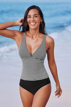 Get ready to shine with the Striped Plunging Tankini Top & Standard Black Bottoms Set! This ensemble combines a boldly striped tankini top with a deep plunge neckline and sleek standard black bottoms. It’s a classic choice for those who prefer a bit more coverage without sacrificing style. Product code: CAA12D4F092AC Features:  Plunging neckline Adjustable straps Standard rise Standard cut leg Classic standard bum coverage Pattern: Stripes Lining: 92%POLYESTER,8%SPANDEX Material: 90%POLYESTER,10%SPANDEX. Striped V-neck Swimwear For Beach, Black V-neck Tankini For Swimming, Black V-neck Tankini For Pool, Striped V-neck Swimwear For Vacation, Striped Sleeveless Tankini For Beach, Striped Fitted Tankini For Beach Season, Fitted Striped Tankini For Beach Season, Striped Tops For Beach Season, Fitted Striped Tankini For Vacation