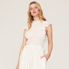 Off-White Cotton (100% Cotton). A-Line. Short Sleeves. Mock Neck. A Figure-Skimming Smocked Bodice Balances Laser Cut Eyelet Flutter Sleeves In This Sweet Summer Midi By Sea New York. White Flutter Sleeve Midi Dress For Spring, White Feminine Midi Dress With Flutter Sleeves, White Fitted Midi Dress With Flutter Sleeves, White Ruffled Midi Dress For Daywear, White Ruffle Midi Dress For Daywear, White Flutter Sleeve Dress With Smocked Bodice, White Dress With Smocked Bodice And Flutter Sleeves, Feminine White Dress With Smocked Back, White Midi Dress With Smocked Back And Short Sleeves