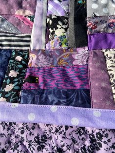 a patchwork quilt with many different colors and patterns on it's edges,