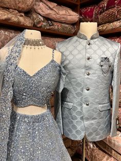 Men's Sherwani: Classic Bandhgala aka Nehru Jacket. The Indian version of a suit Comes with matching trousers Crafted with a collar neckline, full sleeves, and front button closure. Women's Bridal lehenga: Grey color lehenga intricate with fully sequence, studs motifs thread embroidery and crystal stone flared lehenga. Styled with same work blouse and net dupatta. Fabric: Net Formal Party Wear Choli With Zari Work, Formal Party Wear Choli With Resham Embroidery, Formal Choli With Resham Embroidery, Formal Party Wear Choli, Elegant Party Lehenga With Naqshi Details, Festive Party Lehenga With Naqshi Detailing, Unstitched Bollywood Choli For Formal Occasions, Formal Party Wear Choli With Dupatta, Fitted Bollywood Party Suits