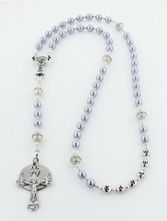 a rosary with a silver cross on it