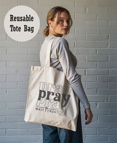 Get ready to elevate your everyday style with our 100% cotton canvas tote bag! This versatile and durable bag is perfect for all your daily needs, whether it's shopping, running errands, or a day out with friends. Here's why you'll love it: 🛍️ One Size Fits All: Measuring 15" x 16", it's spacious enough for your essentials and more. 🎨 Vibrant Designs: The canvas material showcases your favorite designs in brilliant colors. 💪 Built to Last: Made from heavy fabric (12 oz/yd² or 406.9 g/m ensuri Everyday Canvas Bag With Letter Print, Eco-friendly Canvas Bag For Daily Use With Branding, Eco-friendly Everyday Canvas Bag With Branding, White Cotton Canvas Bag For Daily Use, Eco-friendly Canvas Bag For Everyday, Everyday Cotton Canvas Bag With Branding, Branded Tote Canvas Bag For Everyday, Everyday Branded Tote Canvas Bag, White Canvas Bag With Branding For Everyday Use