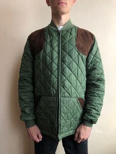 Belstaff Jacket / Belstaff Quilted Jacket / Size M / This vintage quilted jacket in good condition with signs of wear, thread broken on some stitches (last photo) - made in England - brand - BELSTAFF - ERA - 1980's - color - green - zipp at front- YKK - 2 outside pockets - 1 back pocket - 1 inside pocket - leather patches on shoulders, elbows and pockets - material - nylon, polyester - fit size - M  (watch measurements) FLAT Measurements: Shoulders : 45,5cm Chest (underarm to underarm) : 58cm Sl Retro Quilted Long Sleeve Outerwear, Quilted Retro Outerwear, Vintage Quilted Cotton Outerwear, Vintage Quilted Outerwear For Fall, Vintage Cotton Quilted Jacket For Fall, Vintage Quilted Jacket With Pockets For Fall, Brown Quilted Cotton Outerwear, Vintage Cotton Quilted Jacket For Winter, Winter Vintage Cotton Quilted Jacket