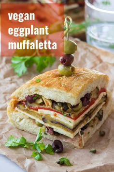 an eggplant muffin is stacked on top of each other with olives