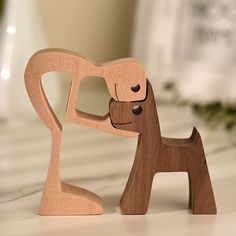 a wooden toy dog with its mouth open