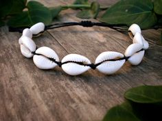 Channel your inner bohemian goddess with this natural shell ankle bracelet!Beautiful natural cowrie shells, wrapped by hand in black waxed thread, 100% waterproof and super durable.The anklet size is adjustable with a safe sliding knot easy to tighten and loose depending on your each time needs! ****************MEASUREMENTS:The ankle bracelet't length is adjustable, but please select your exact size from the options above for the perfect fit.Cowrie shells size: 1.5 - 2 cm/ 0.59'' - 0.78''To meas Adjustable Casual Shell Necklace, Casual Adjustable Shell Necklace For Festival, Casual Adjustable Shell Necklace, Casual Shell Necklace For Festival, Casual Adjustable Shell Necklace For Beach, Casual Adjustable Shell Necklace For Vacation, Casual Adjustable Shell Top, Adjustable Beach Shell With Cord, Beach Shell With Adjustable Cord