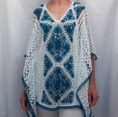 White and blue cover up with diamond shape pattern in the middle of front and back, which splits into triangles around the neck. The border is blue. There are two white cords with blue endings, which allow the width to be adjusted according to the figure, and the way it is worn. It can be a tunic, a short caftan, a beach dress, a swimsuit cover up. Very light and fine cotton beachwear. The white and blue color, as well as the lace pattern gives the pleasant feeling of summer holiday, relaxation; White Summer Tunic Kaftan, White Tunic Beach Dress, White Tunic Kaftan For Beach Season, White Tunic Kaftan For Summer, Beachy White Tunic Cover-up, Blue Cotton Summer Cover-up, Blue Tunic For Summer Beach Cover-up, Blue Summer Tunic For Beach Cover-up, White Beach Cover-up Tunic