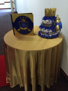 a table topped with a cake next to a card