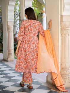 A poetic rendetion of a summer festive collection that makes you nostalgic, in classic luminous block prints. Handcrafted on a bed of fine cotton, mul and doria in hues of pastels. Perfect for light occasions. A set of 3 consists of kurta, pants & dupatta. Kurta: Summery florals combined with the most delicate silhouette inspired by the vintage bhopali peach kurta. This round neck, side gathered ghera kurta in cotton with loop button and gota detailing is a summer staple . Finished with hand pri