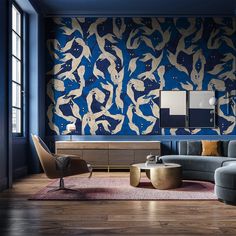 the living room is decorated in blue and gold tones with birds painted on the wall