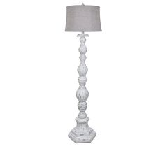 a white table lamp with a gray shade on the top and bottom part of it