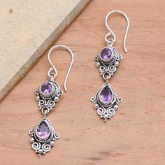 Dewi Putera in Bali creates these lovely amethyst earrings with a touch of vintage flair. The sterling silver dangle earrings feature ornate traditional motifs like bun (curled wires) and jawan (silver granules). Purple Earrings With Intricate Design As Gift, Purple Earrings With Intricate Design For Gift, Ornate Purple Pierced Earrings, Ornate Purple Sterling Silver Earrings, Ornate Purple Jewelry With Matching Earrings, Traditional Purple Teardrop Jewelry, Ornate Purple Dangle Earrings, Ornate Purple Drop Earrings, Ornate Purple Dangle Jewelry