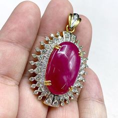 "This gorgeous, vivid, HUGE CABOCHON-Shaped, Burmese Ruby and stunning, impeccably graded F/VS Diamonds will totally melt everyone's heart! EXTREMELY RARE ENORMOUS 40.89 CARATS BURMESE RUBY with ATTRACTIVE, VIVID, HOT-PINKISH-RED color. SET IN FINE 18K SOLID YELLOW GOLD HANDCRAFTED PENDANT! ONLY ONE ITEM AVAILABLE!! WHAT YOU SEE IN THE PICTURES IS WHAT YOU WILL GET   \"You will get the best GEMSTONES from the most experienced GEMS wholesaler in the world.\" SUGGESTED RETAIL VALUE: $35,000 RUBY: Exquisite Ruby Jewelry Gia Certified, Dazzling Gia-certified Ruby Jewelry, Dazzling Gia Certified Ruby Jewelry, Handmade Luxury Ruby Jewelry, Exquisite Red Cabochon Jewelry, Ruby Cabochon Pendant Jewelry, Luxury Red Cabochon Necklaces, Luxury Red Cabochon Necklace, Unique Red Diamond Jewelry