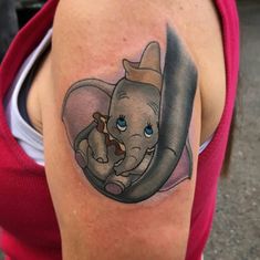 an elephant with a hat on it's head is shown in this tattoo design