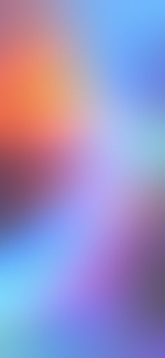 an abstract blurry background in blue, orange and pink