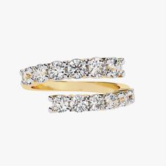 two yellow gold rings with diamonds on each side and one white diamond in the middle