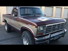 a brown truck parked in front of a building