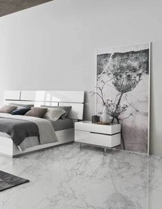 a bedroom with marble floors and white furniture