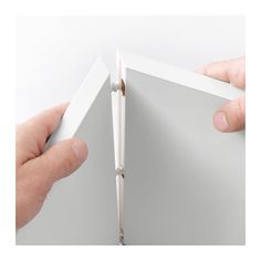 two hands holding an open white box with one opening and the other showing it's inside