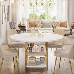 a living room filled with furniture and a white table