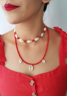 Natural Shell Adjustable Seashell necklace Top Beautiful choker necklace ♥ White color natural shells (with 10 pieces natural cowrie ) ( shells). coral color seed bead ♥min lenght 13 inch ---- max lenght 28 inch ♥ Coral color seed bead necklace 1 big-2 small cowrie- 21 inch ♥Can be worn in different lengths to fit your each time needs. Adjustable closure that tightens and looses with ease for the perfect fit. Just pull the endings and the necklace will close on the length you wish. ♥min lenght 1 Dainty Shell Necklace For Summer Beach, Handmade Casual Cowrie Shell Necklace, Handmade Cowrie Shell Choker For Summer, Summer Handmade Cowrie Shell Choker, Dainty Shell Necklace For Beach, Handmade Strand Choker For Summer, Red Beach Choker Jewelry, Dainty Beach Choker Jewelry, Dainty Beaded Necklaces For Beach