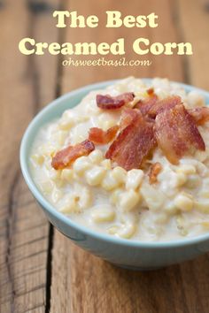 the best creamed corn with bacon in a blue bowl on a wooden table top