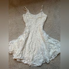 Creamy White Lace Dress From American Eagle. Never Worn And In Perfect Condition. The Dress Is Fully Lined And Has Adjustable Straps. Casual White Mini Length Lace Dress, Casual White Mini Lace Dress, White Lace Mini Dress For Day Out, Casual Cream Lace Mini Dress, Casual White Lace Dress With Lace Trim, Casual White Lace Brunch Dress, Casual White Lace Dress For Brunch, White Lace Dress For Day Out, Casual White Mini Dress With Lace Trim