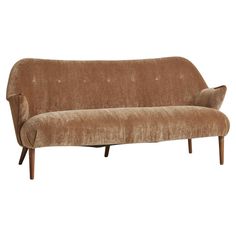 a brown couch sitting on top of a wooden frame